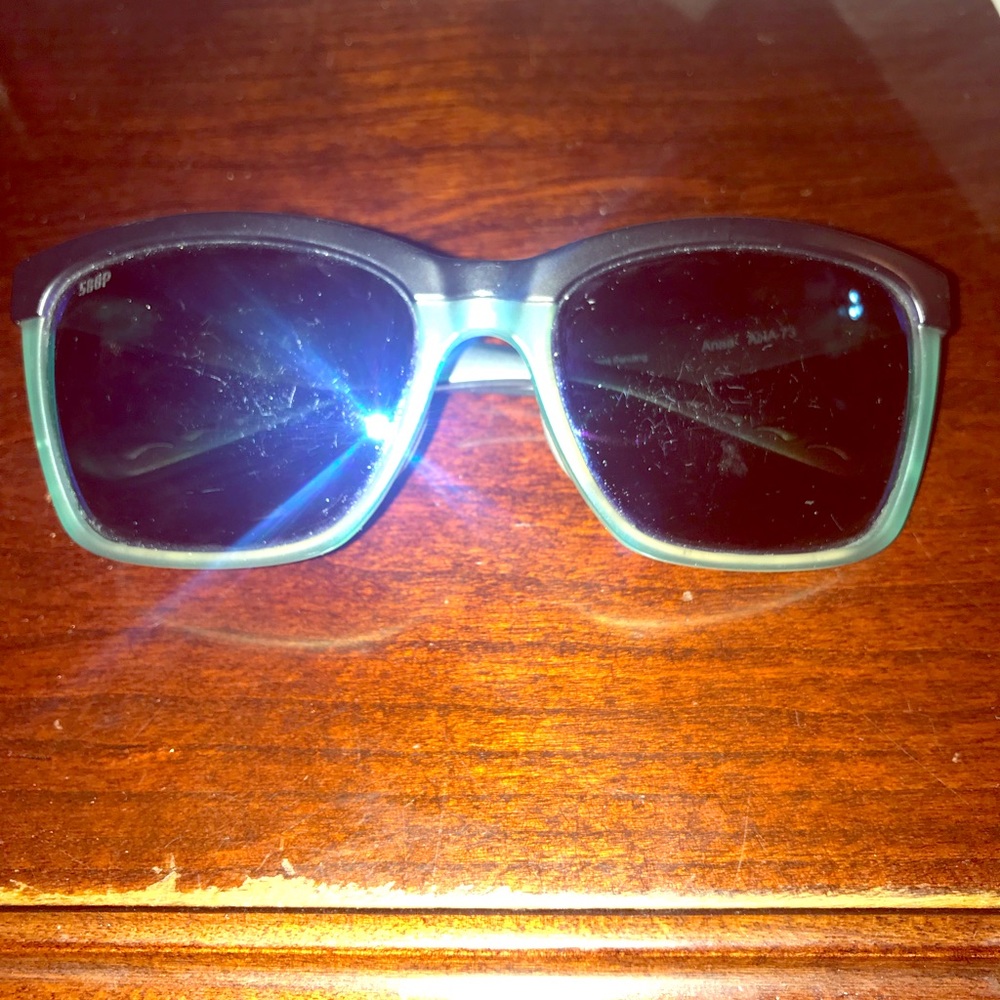 Teal and black costa glasses